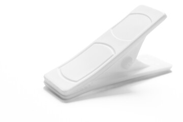 White clothespin isolated on white background close up. Macro photography.
