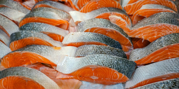 fresh cut salmon fillet as seafood background