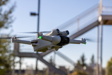 DJI Mini 3 Pro Aerial 4k Quadcopter drone close up in Sunlight flying in the air close up