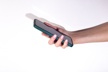 Woman's hand using smartphone on white background