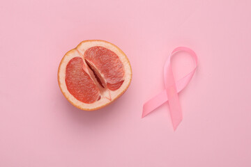 Pink ribbon symbolizing breast cancer awareness day and a grapefruit symbolizing the female vagina...
