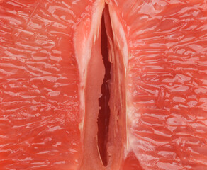 Gynecology, female intimate hygiene. Half of a ripe grapefruit symbolizing the female vagina close up.