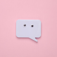 Speech bubble with eyes on a pink background. Creative idea