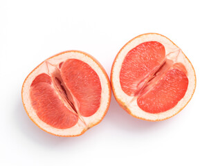 Gynecology, female intimate hygiene. Halves of a ripe grapefruit symbolizing the female vagina on white background. Creative idea, allegory, fresh idea. Top view