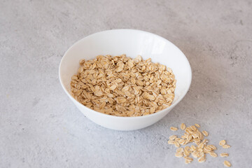 Dry oatmeal in a bowl.