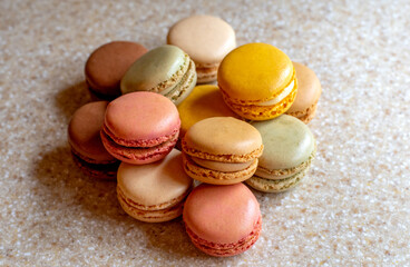 close up still life of macarons, a crispy mereingue cookie with sweet fillings and colorful shells