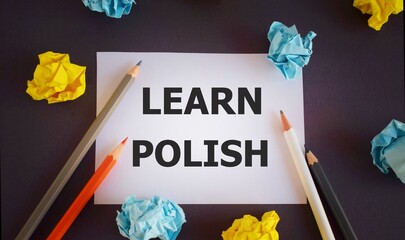 learn polish. text written on white paper,Pencils over white paper, crumpled papers page, dark...