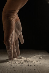 unrecognizable person hand working with flour