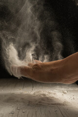 unrecognizable person hand working with flour