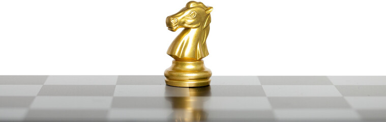 Golden horse chess on a chessboard.