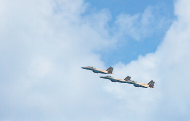 Military aircraft against the blue sky