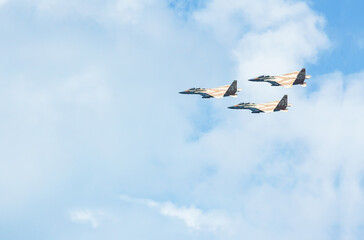 Military aircraft against the blue sky