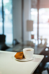 Diet set, a plate of one toast with a cup of black coffee
