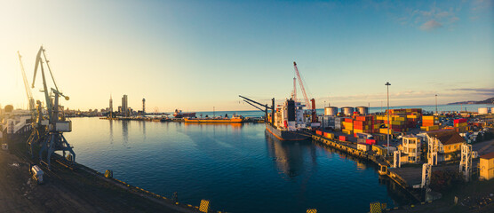 Batumi, Georgia - 25th november, 2021: Cargo ship in Batumi seaport docked with loaded container ....