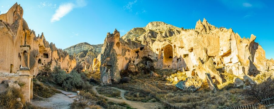 Wide panoramic background image of Zelve open air museum surroundings and fairy chimneys with no people. Cappadocia.Turkey