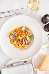 Spaghetti vongole with sauce and parmesan