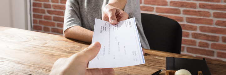 Woman Offering Company Cheque