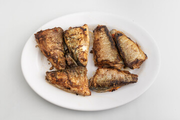 grilled milkfish or Ikan Bandeng Bakar on white plate isolated on white background
