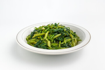 stir fried water spinach vegetable or Tumis Kangkung on white plate isolated on white background