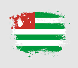 Elegant grungy brush flag with Abkhazia national flag vector