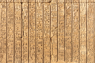 Part of an egyptian temple hieroglyphs engraved on the wall