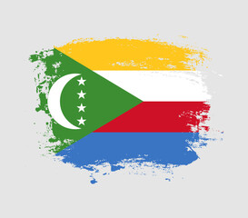 Elegant grungy brush flag with Comoros national flag vector