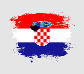 Naklejka premium Elegant grungy brush flag with Croatia national flag vector