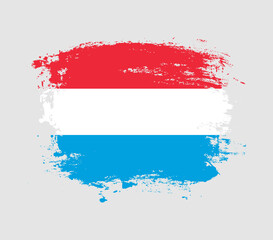 Elegant grungy brush flag with Luxembourg national flag vector