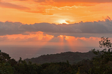 Beautiful sunset from the top of the hill, the sky is golden with clouds around it, the view is really amazingBeautiful sunset from the top of the hill, the sky is golden with clouds around it, the vi