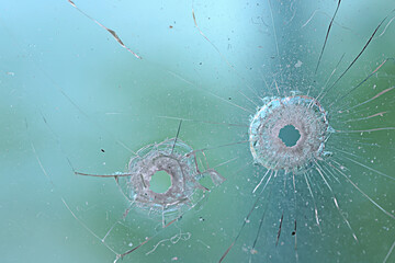 group of bullet holes on the glass abstract background window