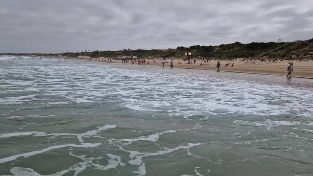 movement of the waves on the beach of La Barrosa in Sancti Petri, Cadiz