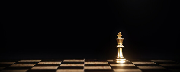 King chess stand on chessboard concept of challenge or team player or business team and leadership...