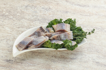 Herring fillet slice on the bowl