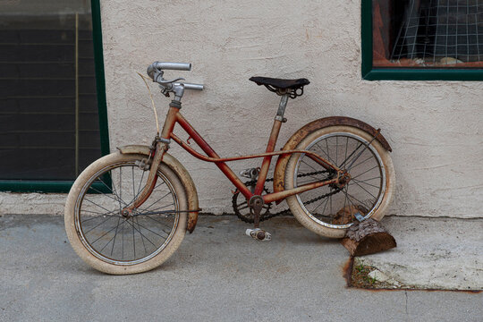Old red retro bike for children