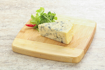 Blue cheese piece over board