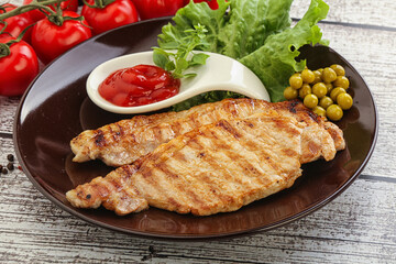 Grilled pork steak with ketchup