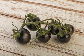 Ripe tasty black cherry tomato