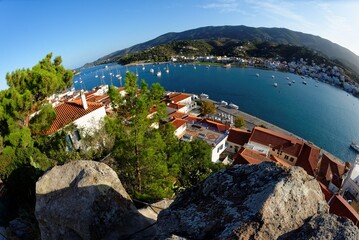 High angle fisheye view of Poros town in Greece in the evening, seen from the bottom of the clock tower