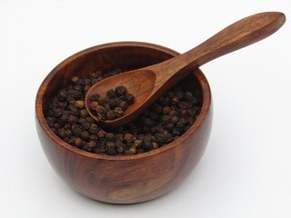 Black peppers in a bowl 