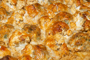 Baked cauliflower with cheese close up