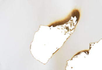 burnt paper frame for texture overlay. damaged white paper with burnt stain in transparent background. blank ripped paper edge for a design element.