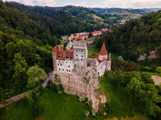 Fototapeta na wymiar Aerial photography over Bran castle in Brasov, Romania. Photography was shot from a drone at a higher altitude with camera pointing downwards for a top view.