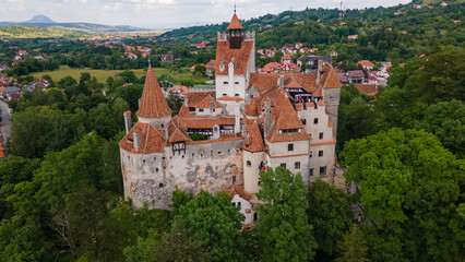 Aerial photography over Bran castle in Brasov, Romania. Photography was shot from a drone at a lower altitude for a landscape still.