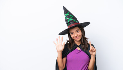 Young hispanic woman dressed as witch over isolated background counting six with fingers