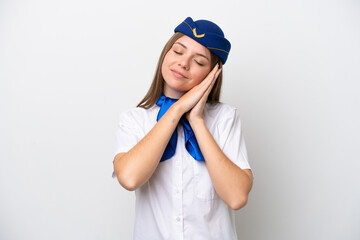 Airplane Lithuanian woman stewardess isolated on white background making sleep gesture in dorable expression