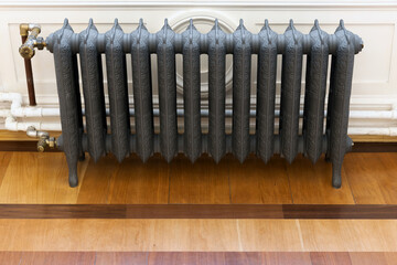 Wintage gray cast iron steam heating radiator, front view