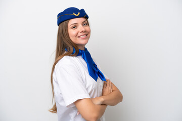 Airplane Lithuanian woman stewardess isolated on white background with arms crossed and looking forward