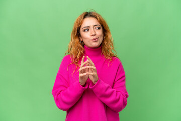 Young caucasian woman isolated on green screen chroma key background scheming something