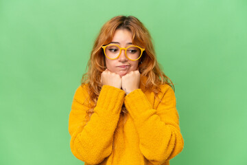 Young caucasian woman isolated on green screen chroma key background With glasses and tired