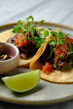 Tacos al pastor with lime